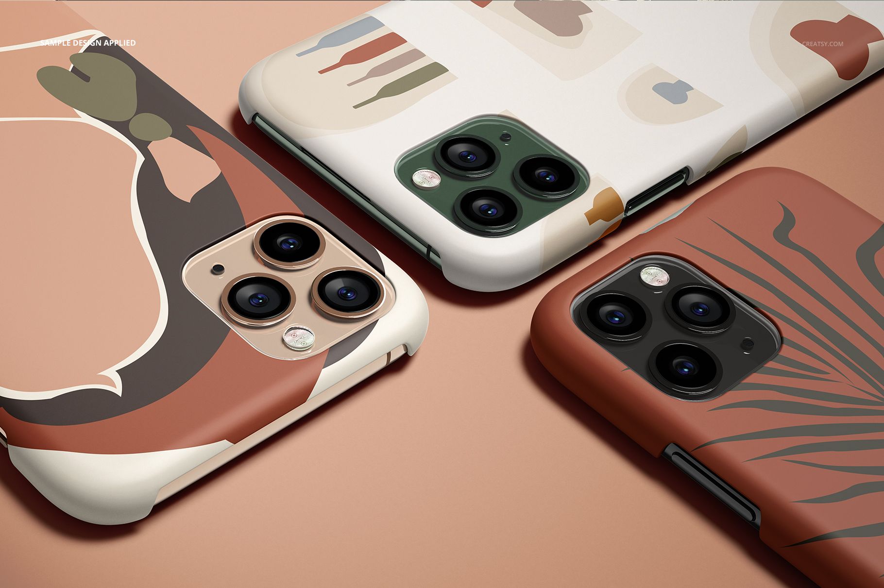 iPhone 11 Pro matte snap case mockup showing three phones with colorful patterns, viewed from an angled perspective.
