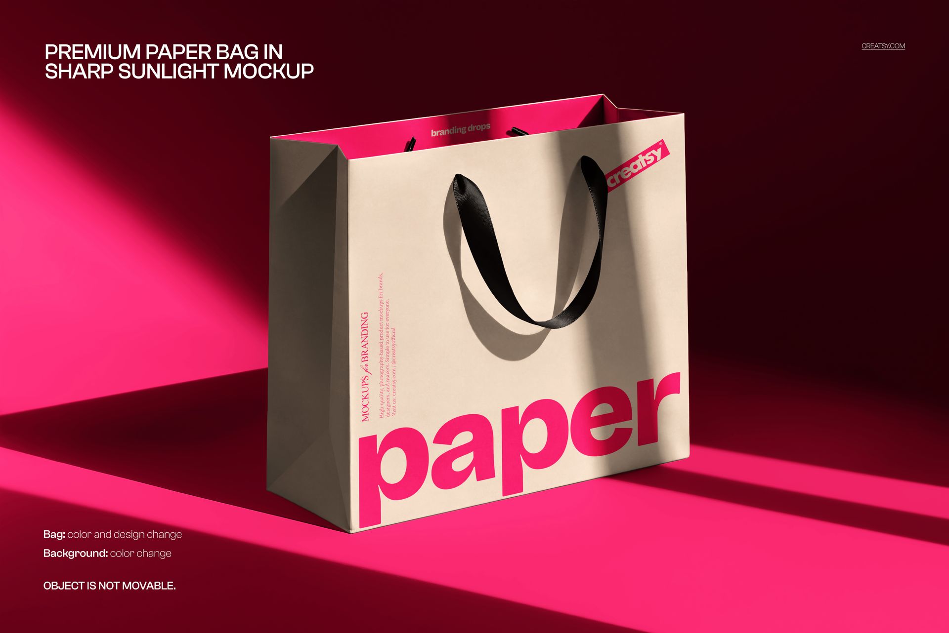 Paper bag PSD mockup featuring a beige bag with black straps and large pink lettering, set against a bright pink background.