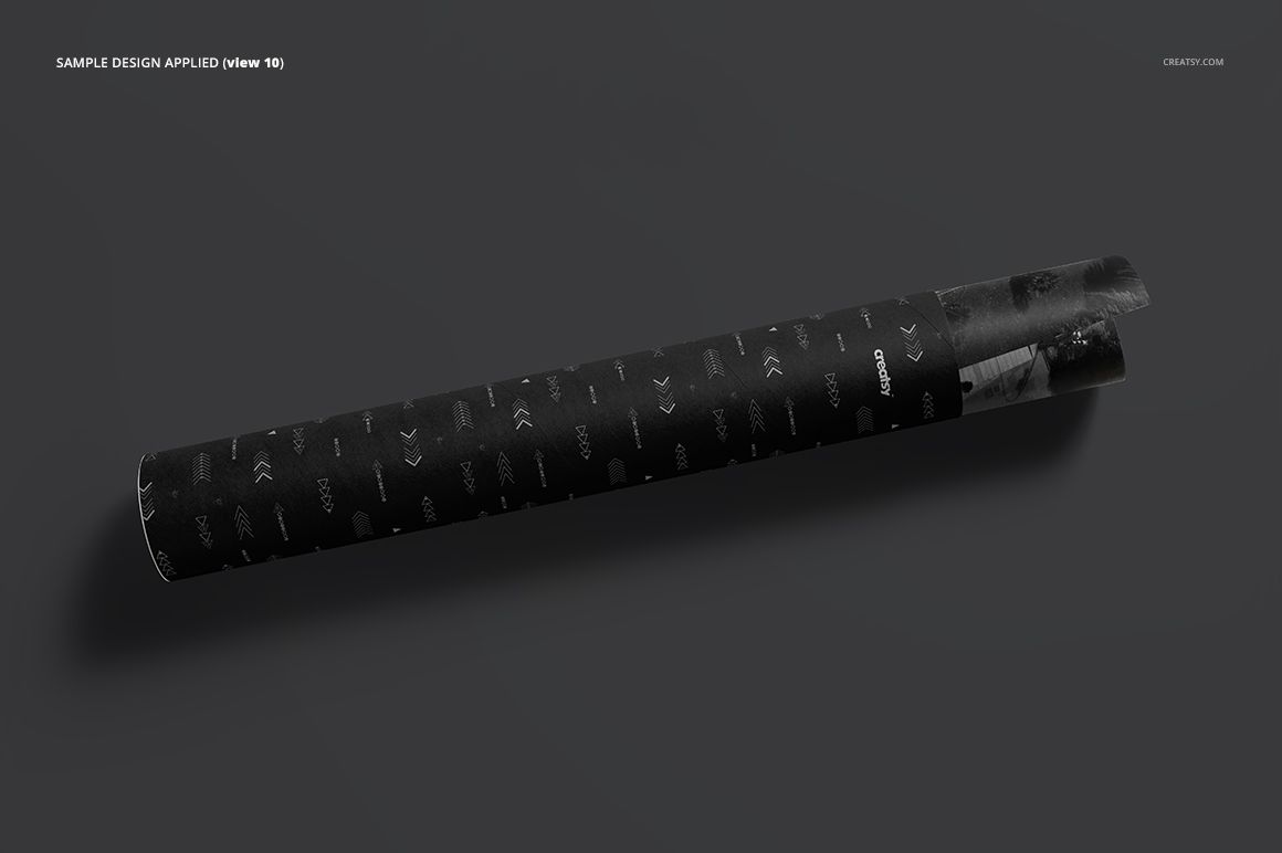 Black mailing tube mockup featuring a subtle repeating pattern, displayed diagonally against a plain gray surface.