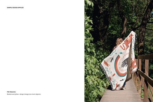 Outdoor scene featuring a PSD mockup of a patterned fringed blanket draped by a person on a wooden bridge surrounded by trees.