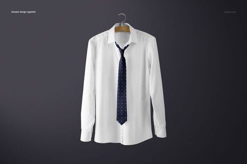 White long-sleeve shirt displayed on a hanger, featuring a navy tie with small geometric motifs, mockup scene.