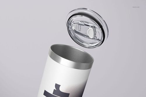 Angled close-up of a powder coated skinny tumbler with a stainless steel rim and transparent lid hovering above.