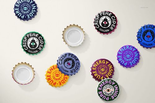 Multiple beverage bottle caps featuring vibrant branding and circular shapes, displayed in a PSD mockup layout.