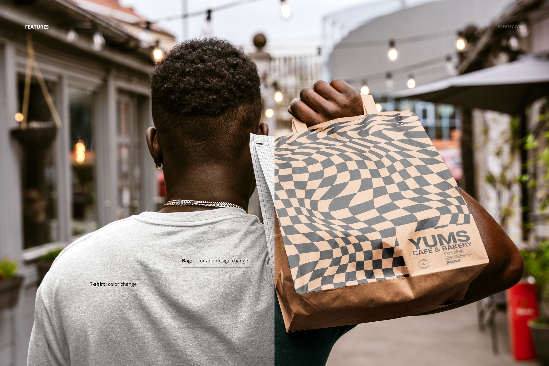 Paper bag mockup featuring wavy design and cafe logo, held by a man in a casual setting with outdoor decor.