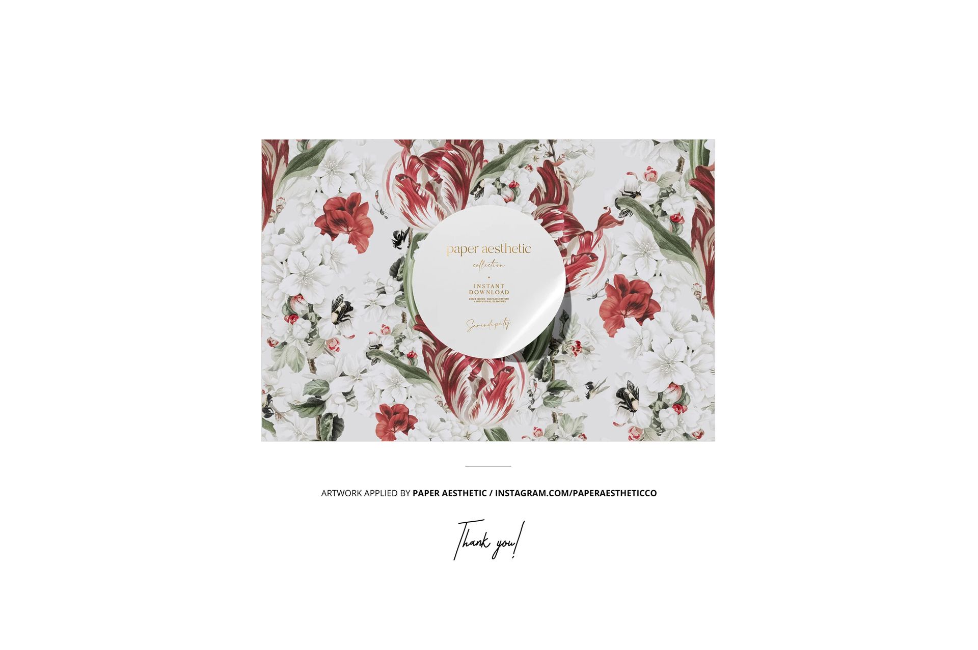 Top view of a fabric mockup displaying a detailed floral print with sewing accessories arranged on the surface.