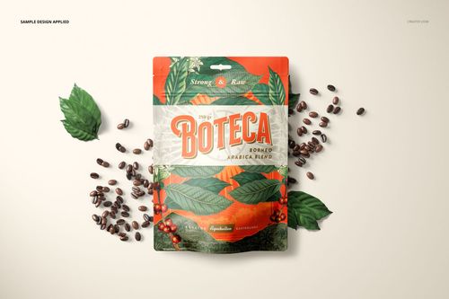Front view of a doypack bag pouch mockup with a colorful label design, surrounded by coffee beans and green leaves.