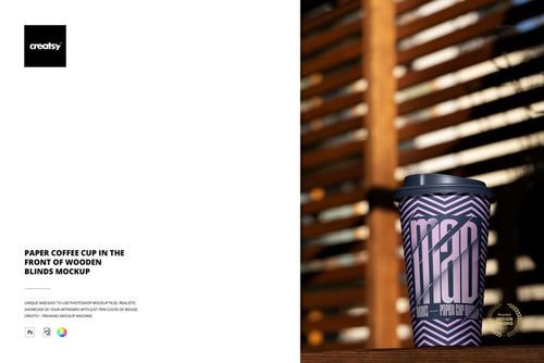 Front-facing paper cup mockup with a bold zigzag design, black plastic lid, and vertical wooden blinds background.