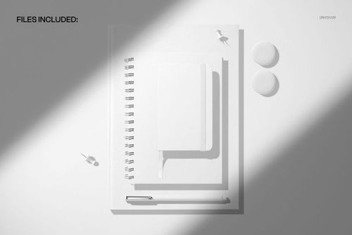 Top view of a spiral journal, hardcover notebook, and pocket calendar mockup in white, arranged with stationery items.