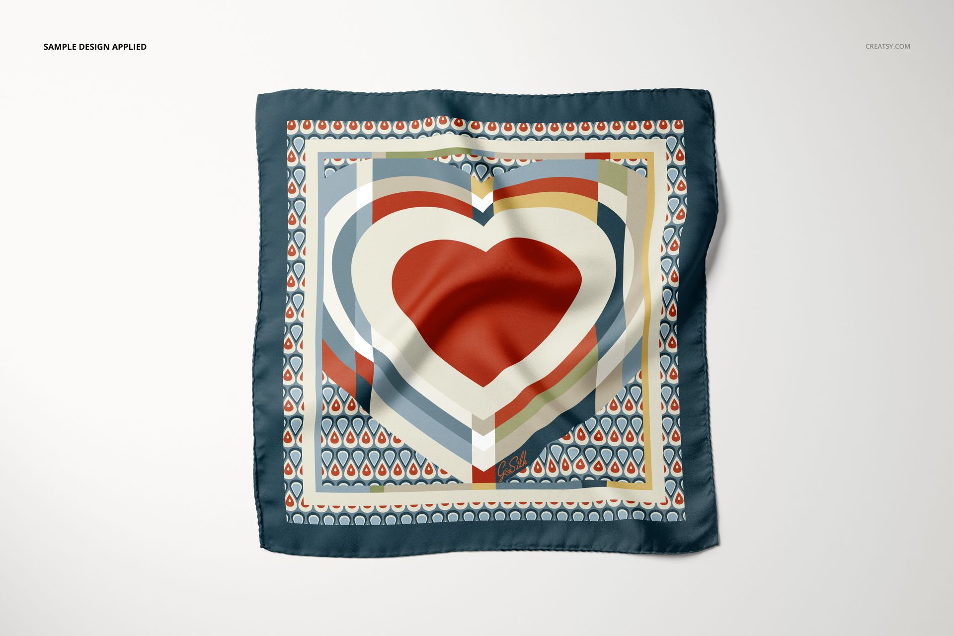Fashion accessory mockup showing a pocket square with geometric and heart motifs, viewed from above against a plain background.