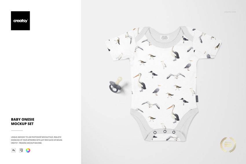 Baby onesie mockup featuring a white fabric with illustrated birds, shown from above with a pacifier nearby.