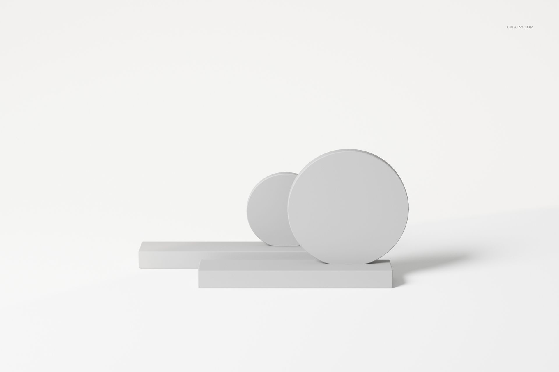 Abstract table decoration featuring two round geometric shapes on rectangular bases, shown from a front angle on a white background.