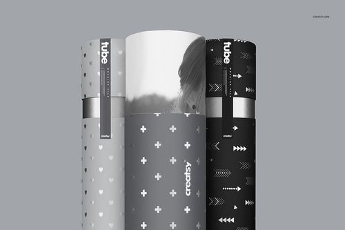 PSD mockup featuring a trio of paper packaging tubes in black and gray, each with unique minimalistic patterns.