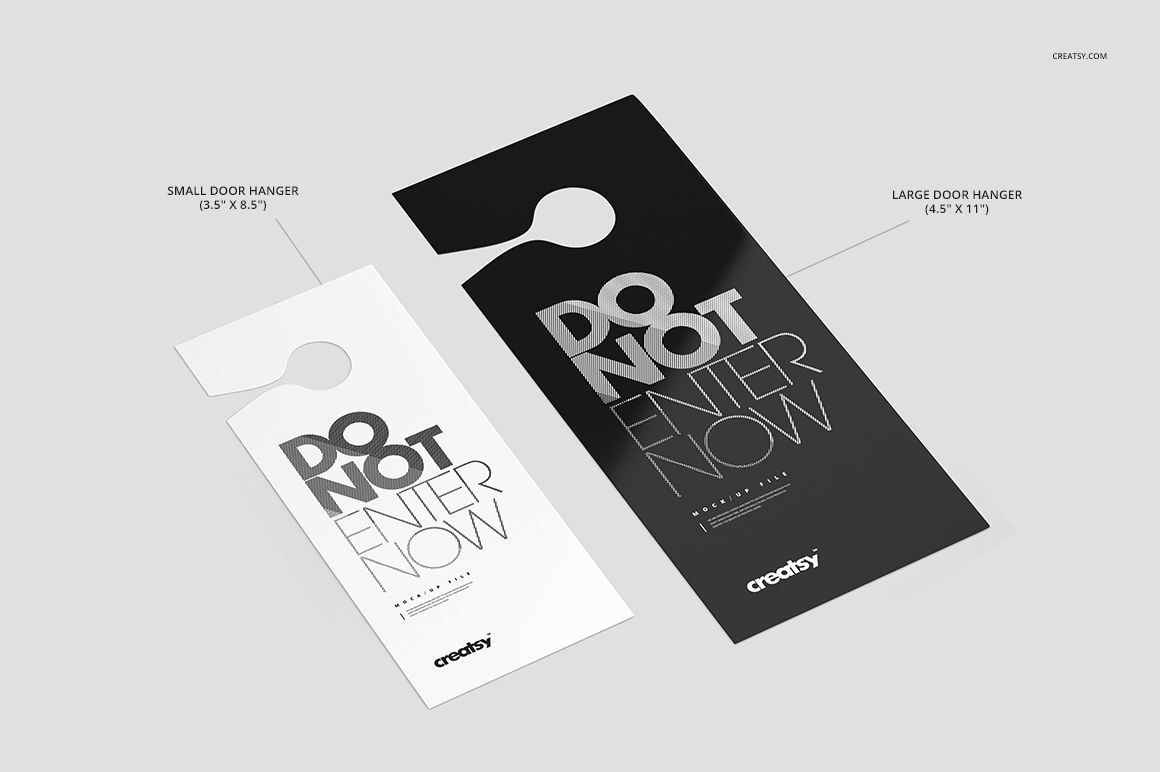 PSD mockup featuring large and small door hangers, each with a circular cut-out and contrasting monochrome colors.