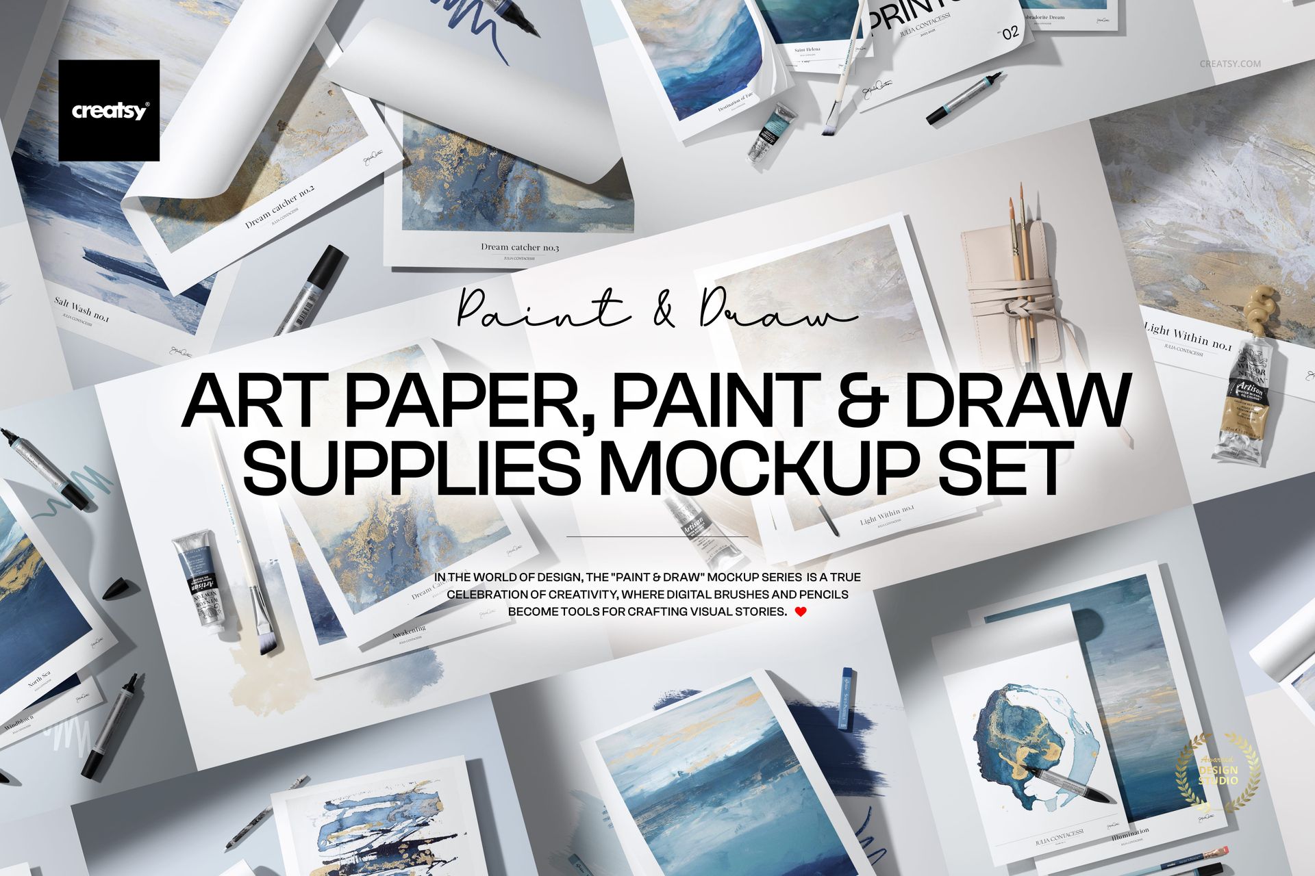 Various art paper sheets, paint tubes, brushes, pencils, and markers arranged on a white surface in a studio mockup.