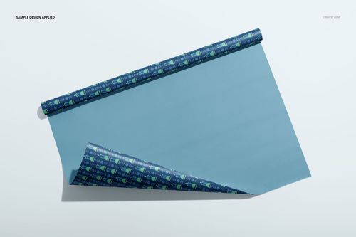 Rolled gift wrapping paper mockup featuring a blue sheet with a patterned edge, displayed on a light background.