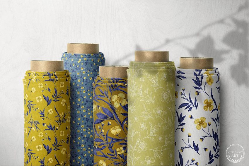 Five fabric rolls mockup arranged upright, featuring floral and botanical patterns in yellow, blue, green, and white tones.