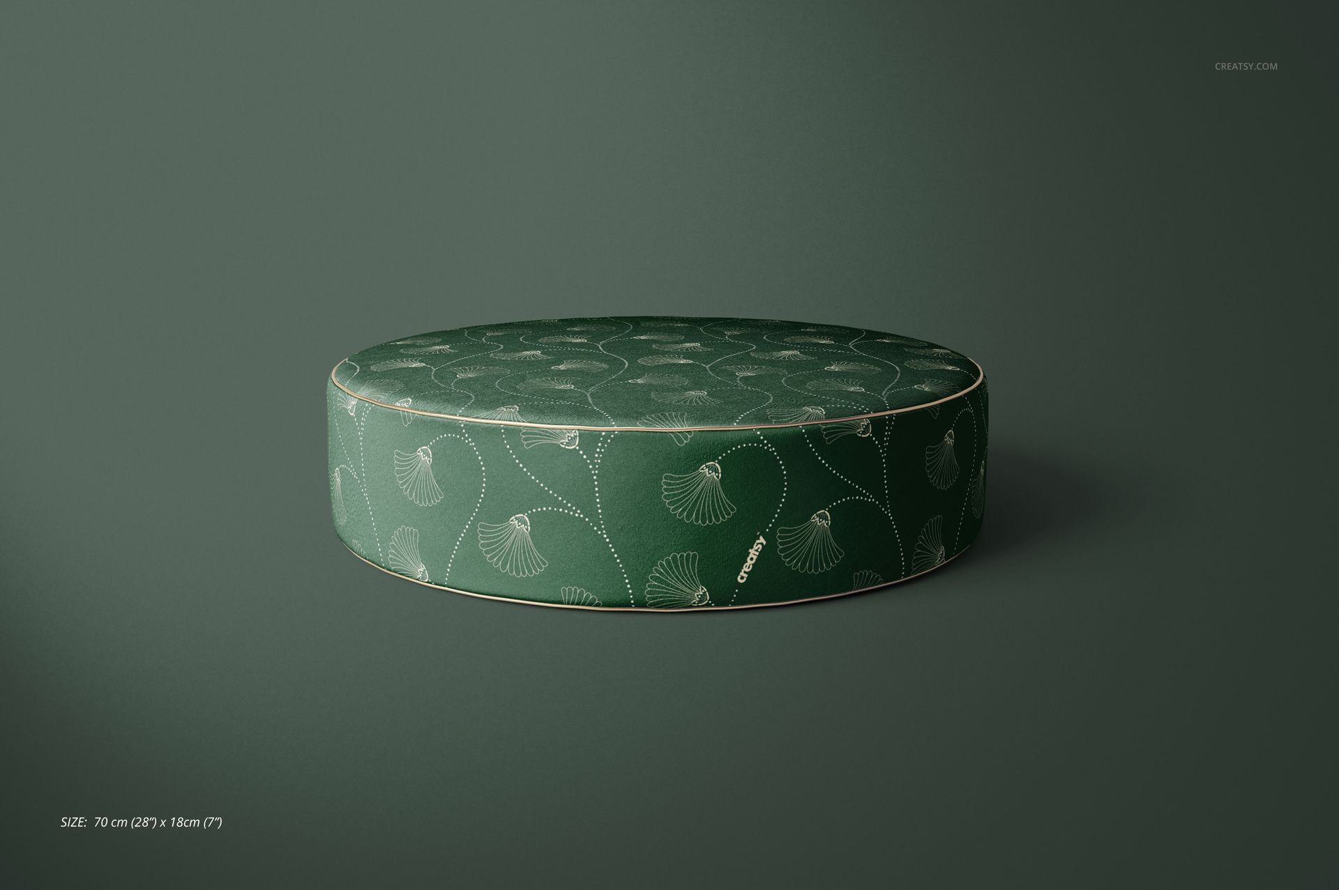 Green velvet pouf mockup featuring a circular shape and delicate botanical design, displayed on a solid background.