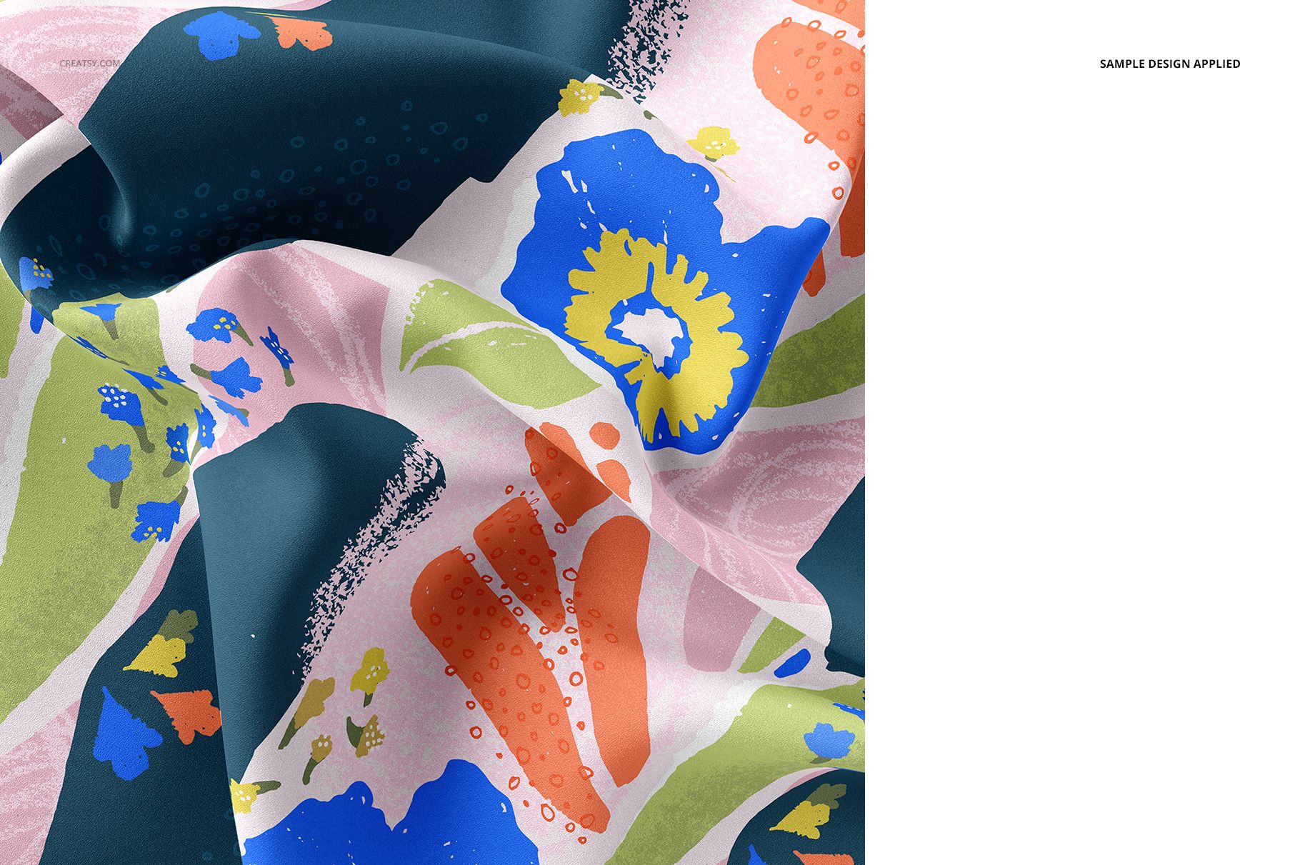 Close-up of silk fabric mockup featuring a colorful abstract floral pattern with blue, green, and orange shapes.