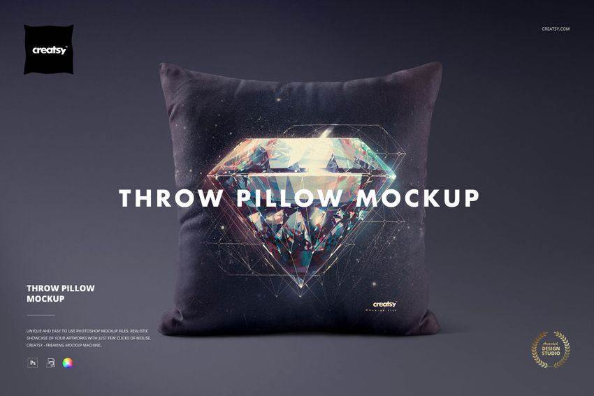Front view of a throw pillow mockup featuring a colorful, faceted diamond illustration on a dark fabric surface.