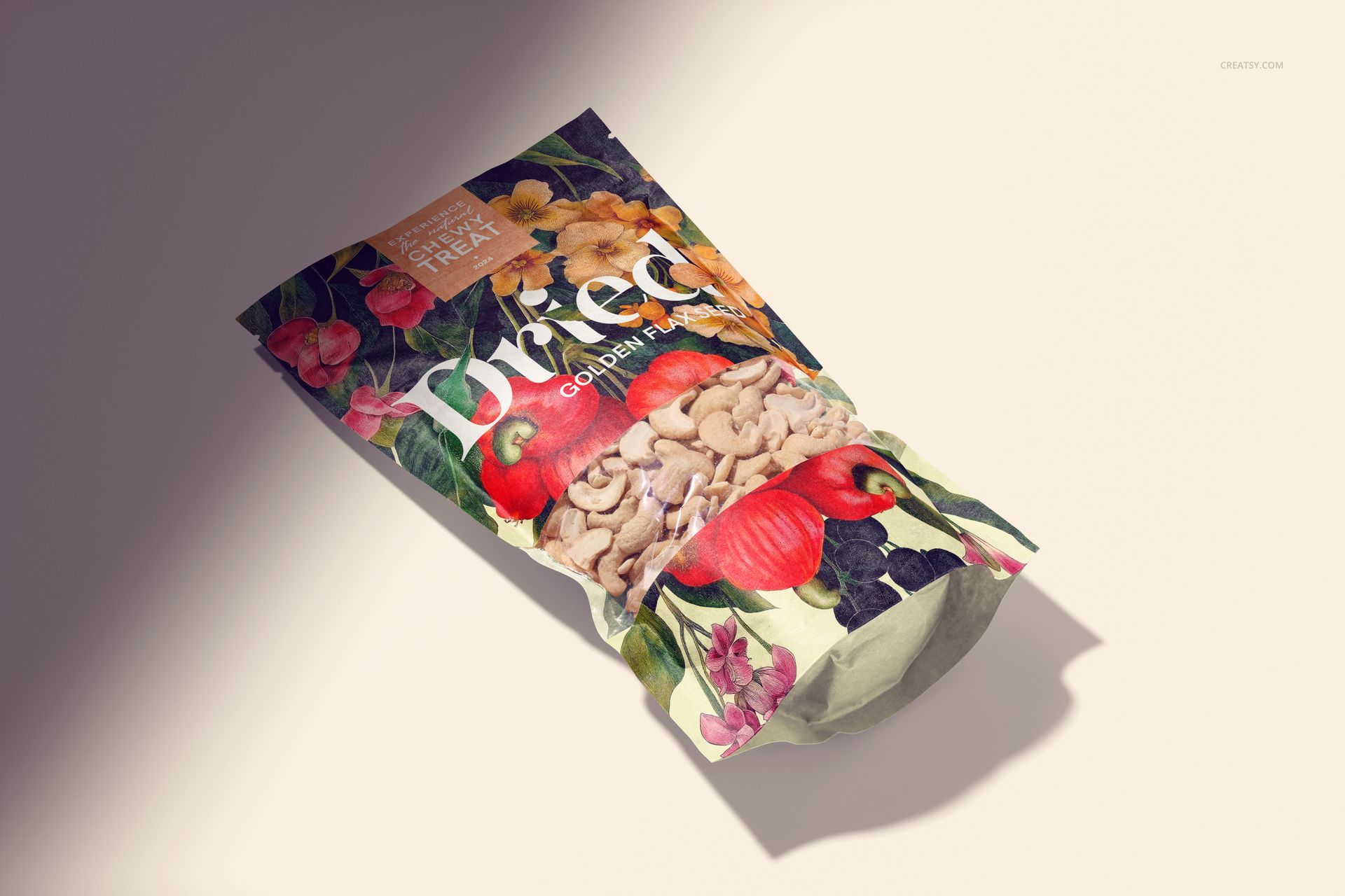Front view of a paper pouch packaging mockup with cashews, featuring colorful floral and nut illustrations.