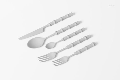 Five-piece bamboo cutlery set including knife, spoon, teaspoon, and two forks arranged on a white surface.