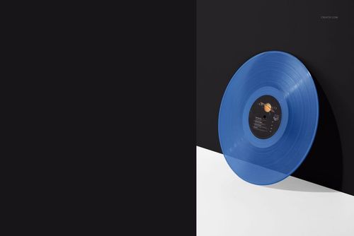 Translucent blue vinyl record mockup shown from a side angle with visible center label on a white and black backdrop.