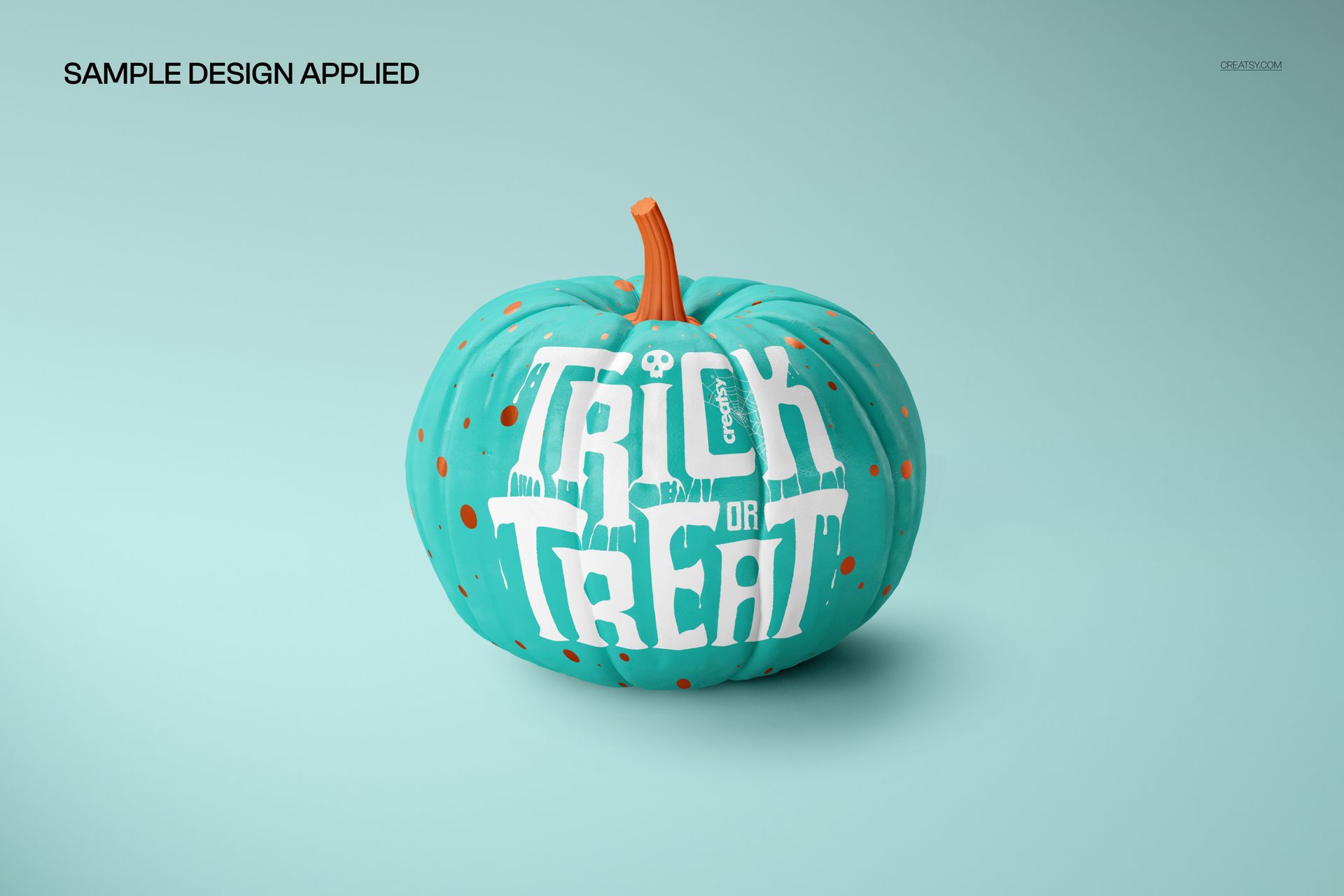 Front view of a turquoise pumpkin with orange dots and 'Trick or Treat' text, shown in a Halloween PSD mockup.