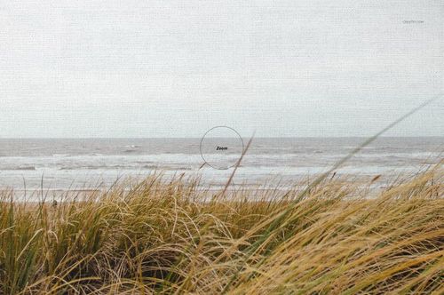 Front view of a thick canvas print mockup featuring a coastal scene with tall grass and ocean waves under a cloudy sky.