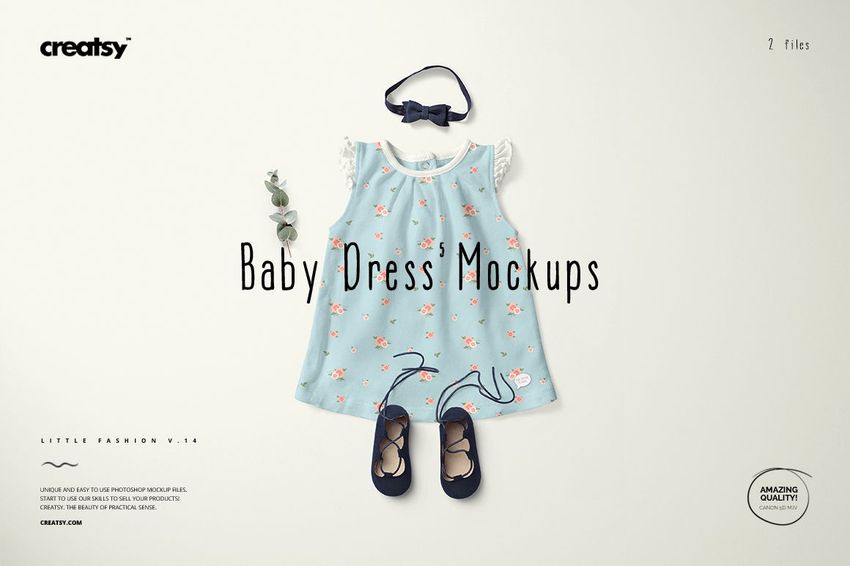 Front view of a baby dress mockup with light blue fabric, floral pattern, white sleeves, matching shoes and headband.