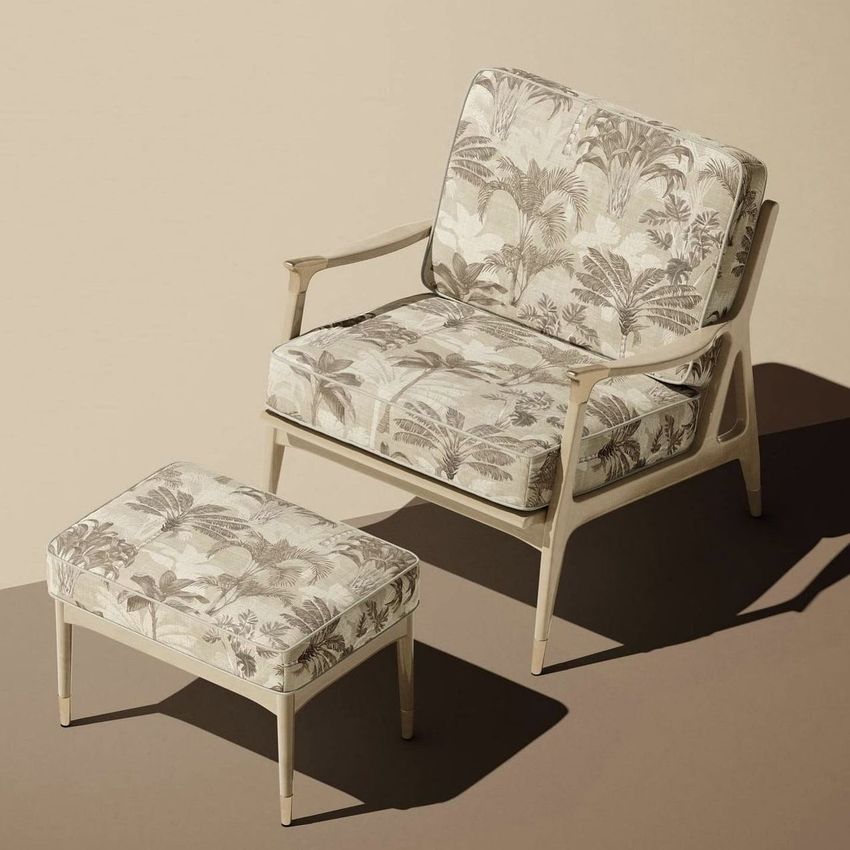 Lounge chair and ottoman mockup with sepia tropical leaf pattern upholstery, shown on a beige background with soft shadows.