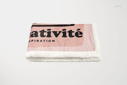 Sherpa blanket mockup displaying a folded blanket with a plush white edge and pink design, viewed from the front.