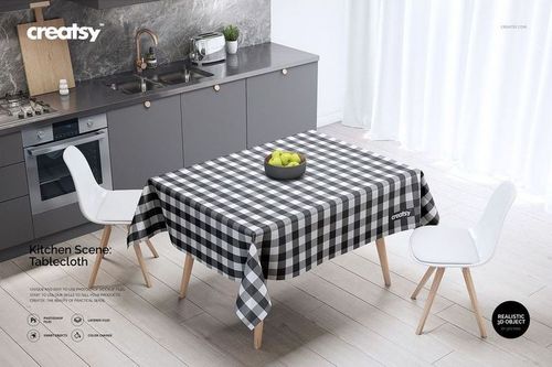 Front view of a mockup tablecloth with a black and white plaid pattern, surrounded by chairs and kitchen cabinets.