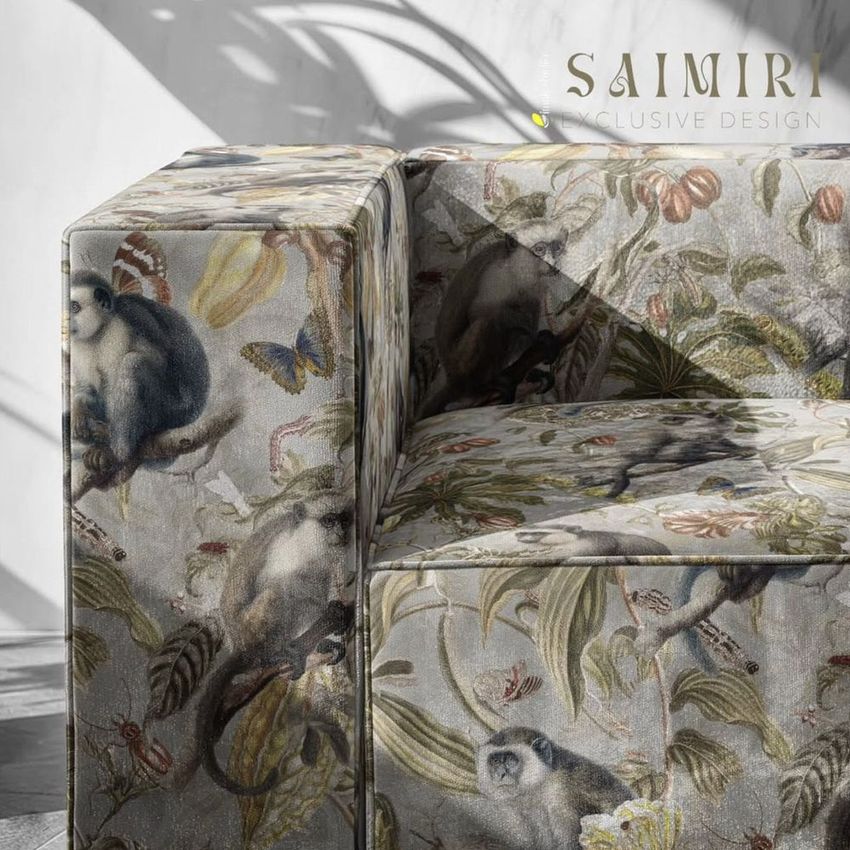 Velvet sofa mockup featuring a closeup of an armchair with a botanical and animal print, set in a sunlit room with shadows.