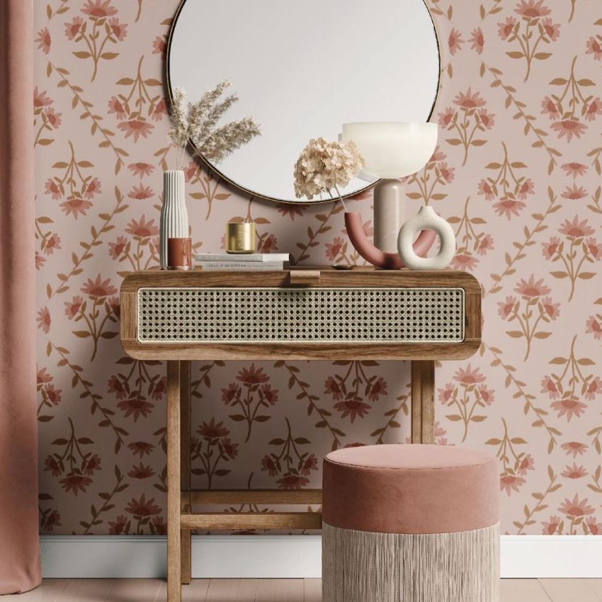 Dressing table mockup featuring a wooden table with cane detailing, round mirror, and floral wallpaper in soft pink tones.