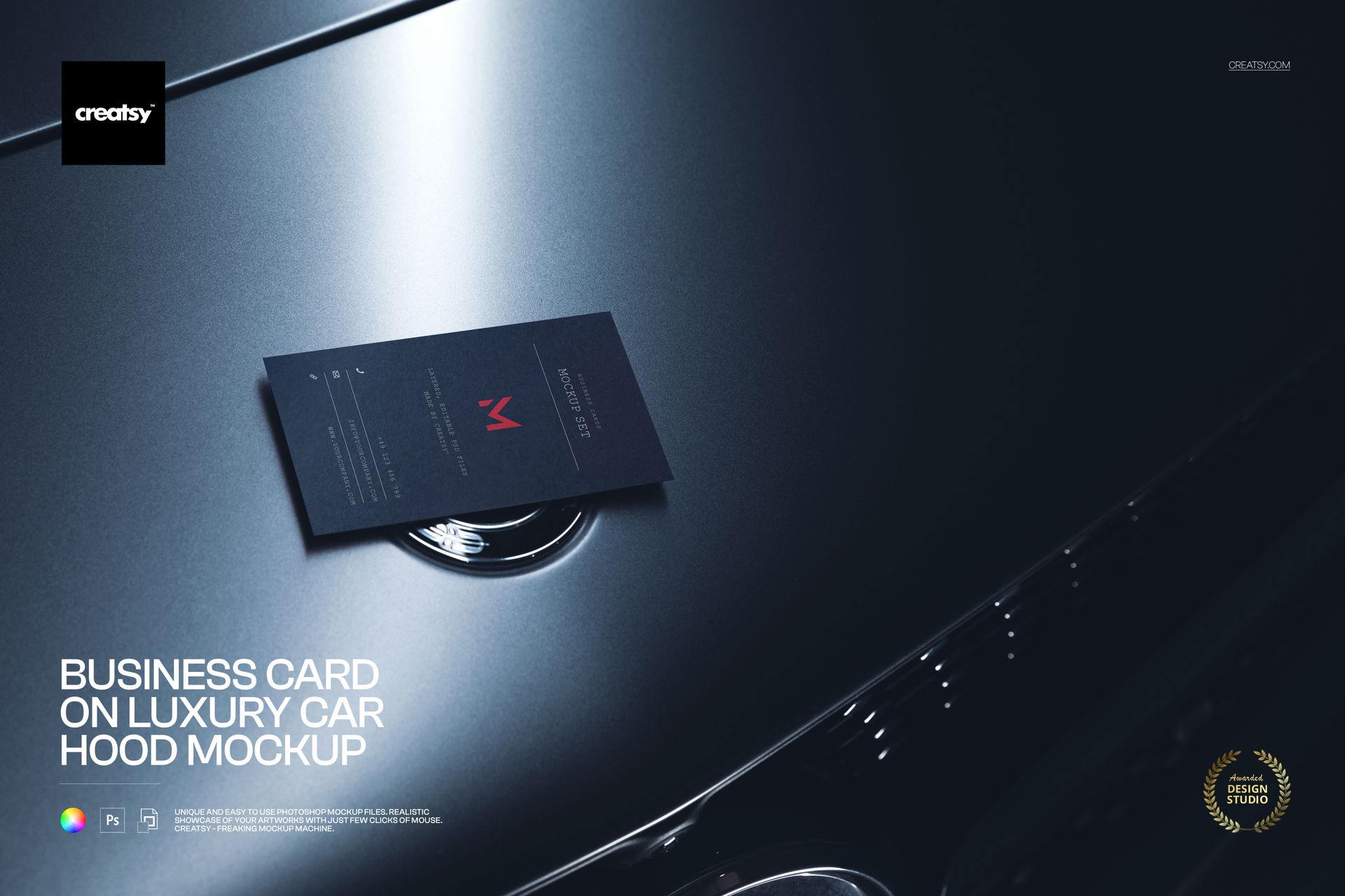 Business card resting on a glossy dark luxury car hood with chrome details, shown in a studio lighting mockup.