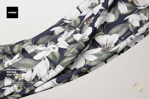 Floating fabric mockup featuring a draped textile with a white floral and green leaf pattern on a dark background.