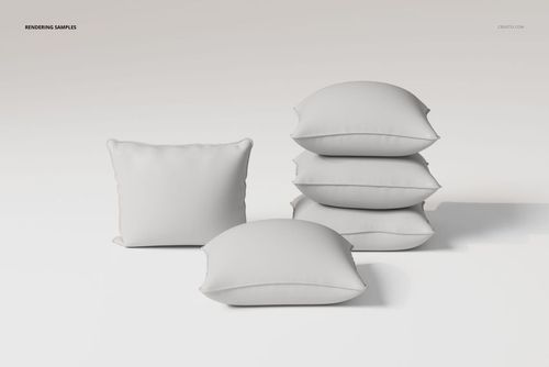 Front view of five white piped cushions arranged on a plain surface, with three stacked and two placed separately.