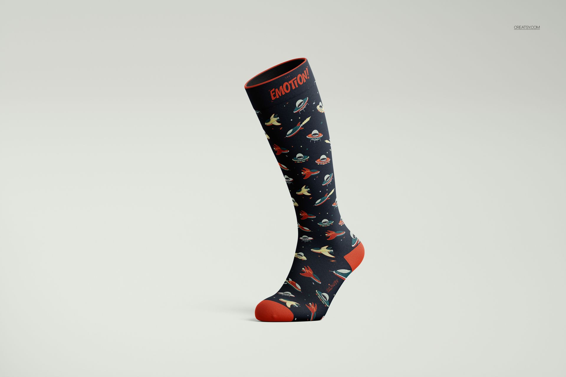 Over the calf sock mockup featuring a space-themed pattern with planets and spaceships, shown in side view on a plain background.