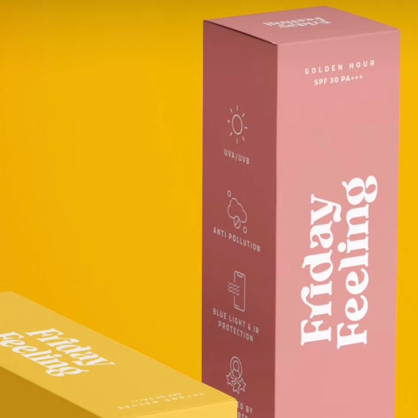Tall box mockup featuring a pink and yellow packaging design with bold white text and icons, set against a solid yellow background.