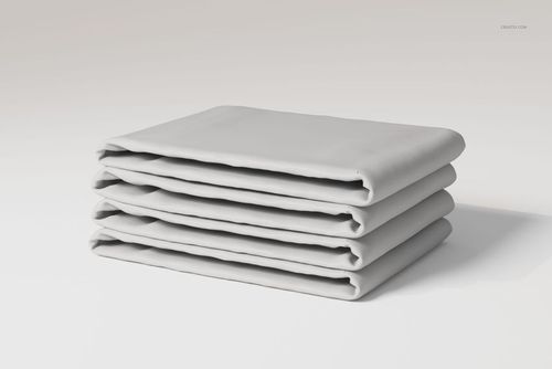 Folded cotton flat sheets in a neat stack, shown from a front angle on a plain light background.