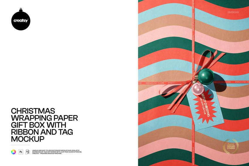 PSD mockup showing a Christmas gift box decorated with multicolored wave pattern wrapping paper, ribbon, and ornament tag.