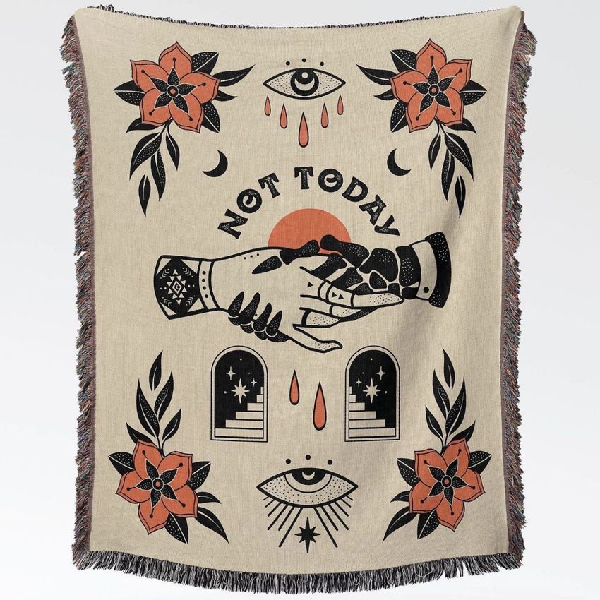 Woven throw blanket mockup featuring a central illustration of two hands shaking, surrounded by floral motifs and geometric shapes.