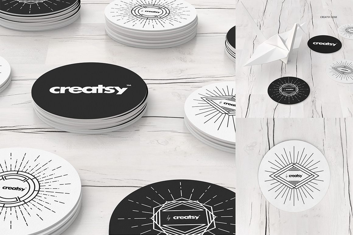 Round coasters mockup set featuring black and white designs with geometric patterns on a light wood surface.