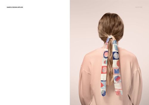Long chiffon silk scarf with colorful geometric pattern tied around ponytail, viewed from behind on model.