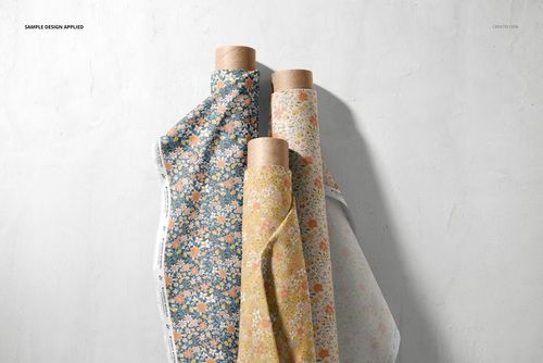 Vertical arrangement of three fabric rolls with small floral prints, displayed in a realistic PSD mockup setting.