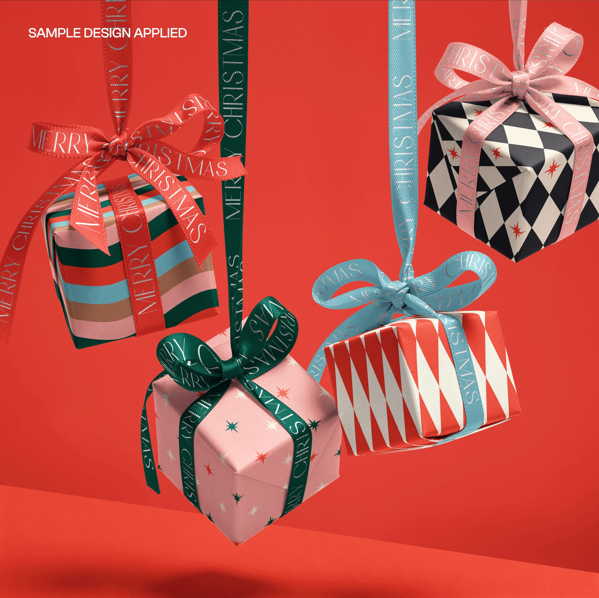 PSD mockup showing four square gift boxes with festive ribbons and geometric designs, hanging on a red backdrop.