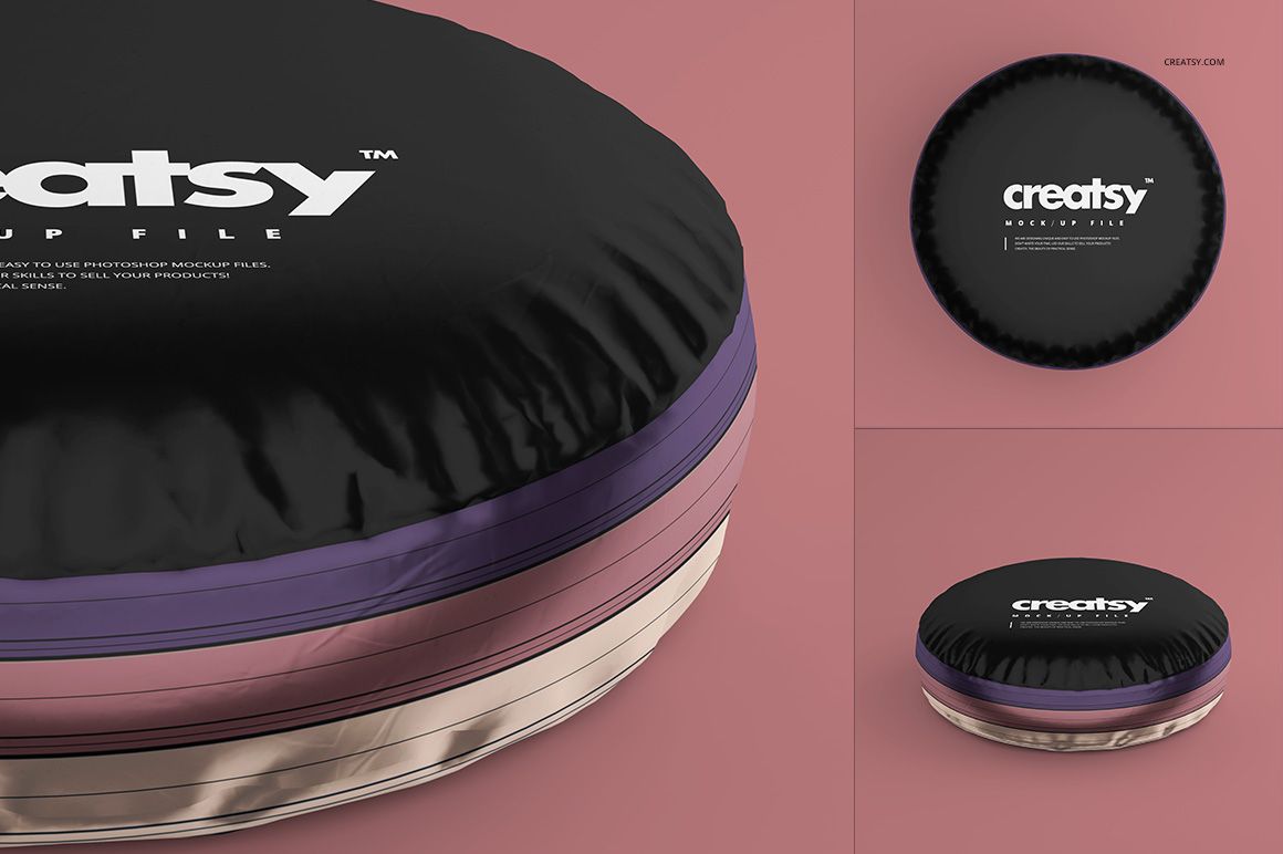 Set of two round pillows with glossy black and metallic surfaces, displayed as a PSD mockup on a pink surface.