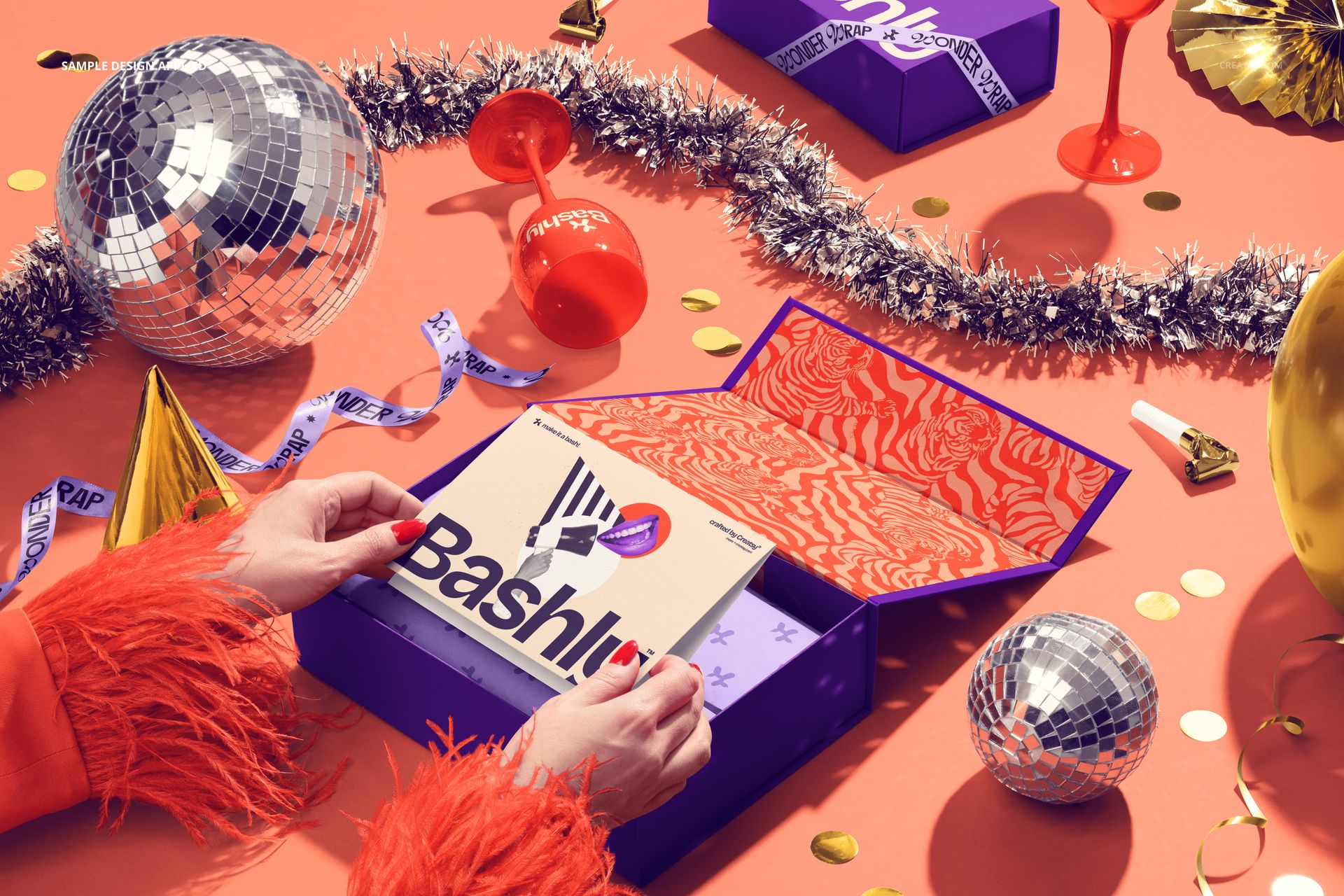Magnetic box packaging mockup with purple exterior and orange patterned interior, surrounded by carnival props.
