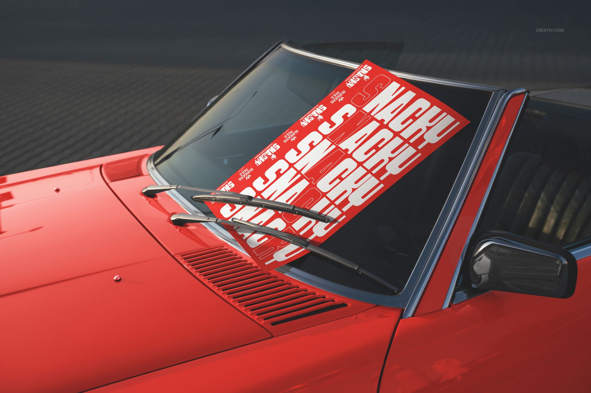 Fast food restaurant branding mockup featuring a red and white poster on a car windshield, outdoor daylight scene.
