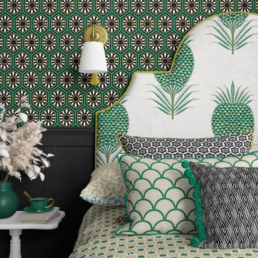 Bedroom pillows, headboard, and wallpaper mockup featuring geometric and botanical patterns in green, black, and white tones.